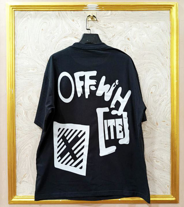Black t-shirt with "Off-White™" design on a hanger against a decorative wall.