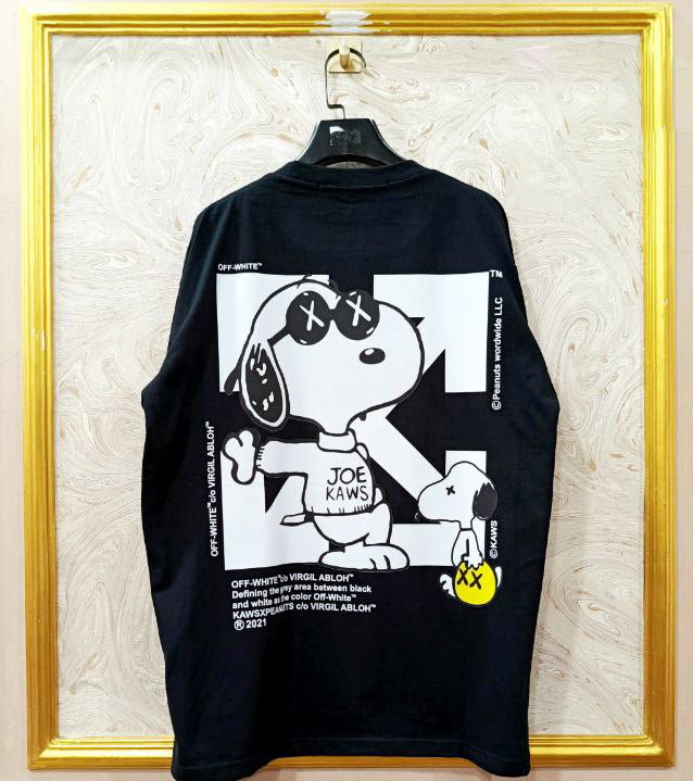 Black t-shirt with "Off-White™" design on a hanger against a decorative wall.