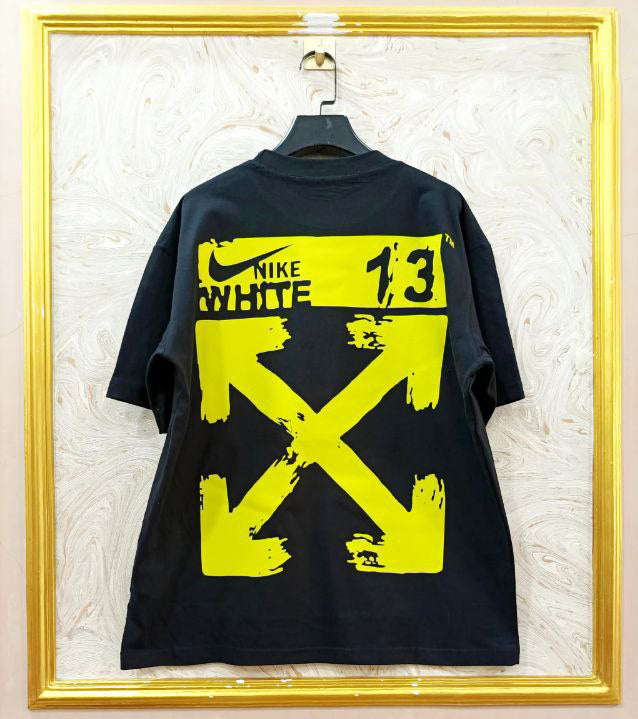 Black t-shirt with "Off-White™" design on a hanger against a decorative wall.