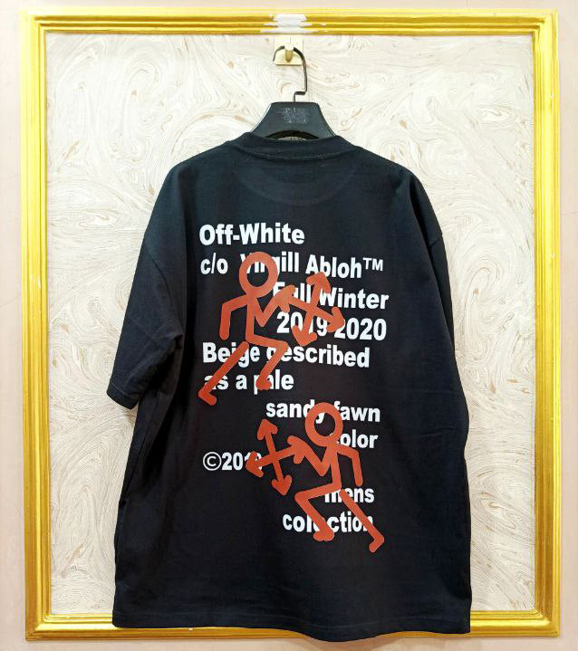 Black t-shirt with "Off-White™" design on a hanger against a decorative wall.