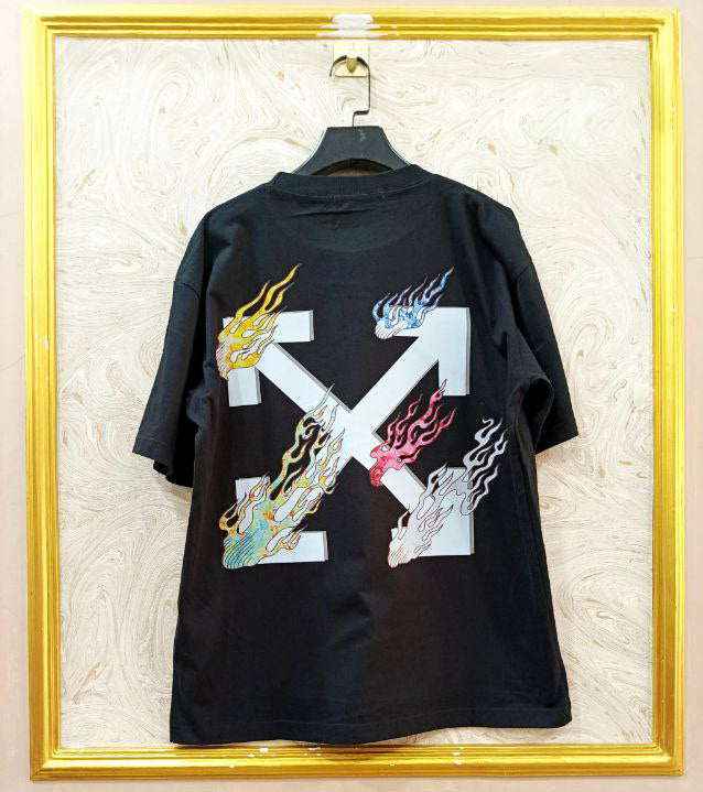 Black t-shirt with "Off-White™" design on a hanger against a decorative wall.