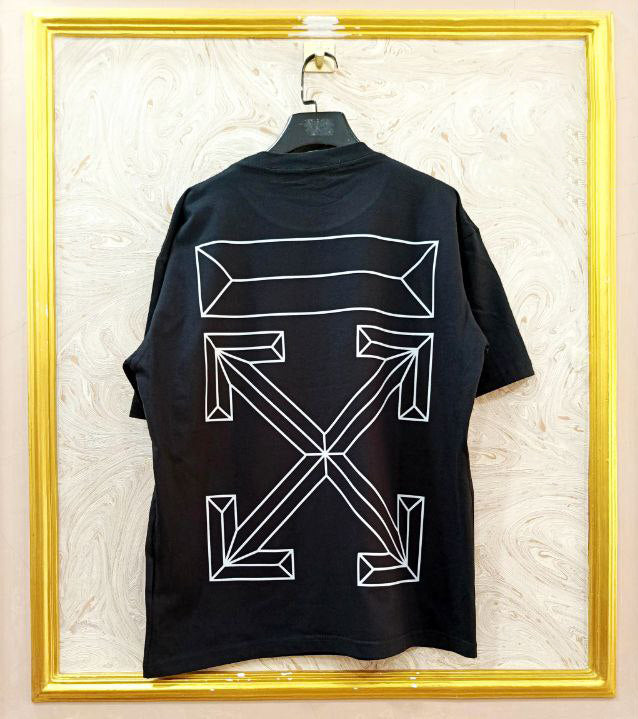 Black t-shirt with "Off-White™" design on a hanger against a decorative wall.