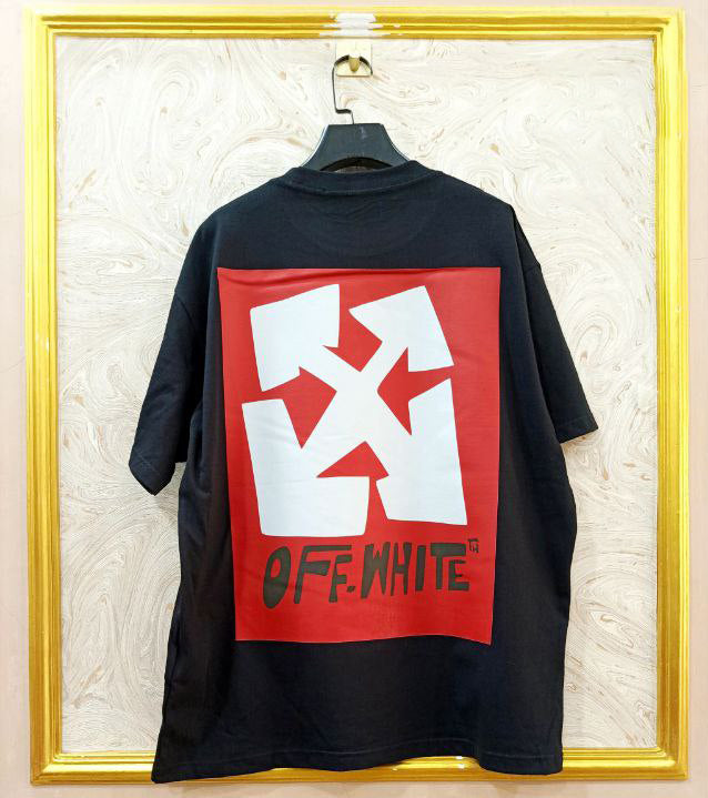 Black t-shirt with "Off-White™" design on a hanger against a decorative wall.