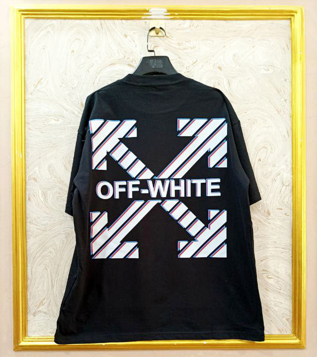 Black t-shirt with "Off-White™" design on a hanger against a decorative wall.