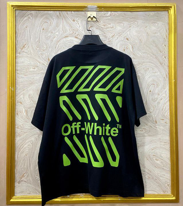 Black t-shirt with "Off-White™" design on a hanger against a decorative wall.
