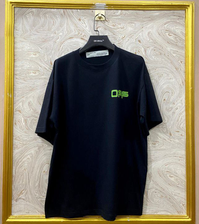 Black t-shirt with "Off-White™" logo on a hanger against a marble wall.