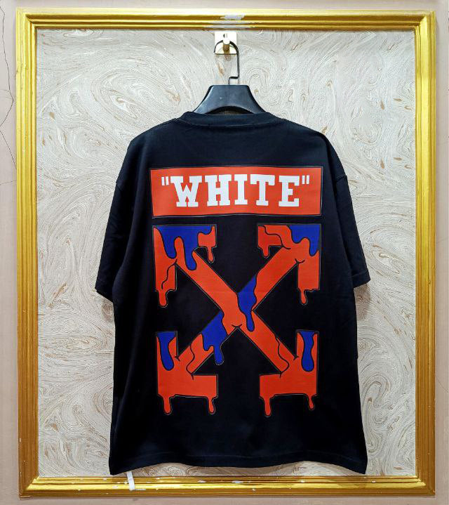 Black t-shirt with "Off-White™" design on a hanger against a decorative wall.