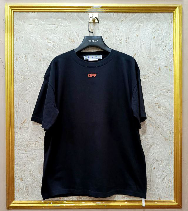 Black t-shirt with "Off-White™" logo on a hanger against a marble wall.