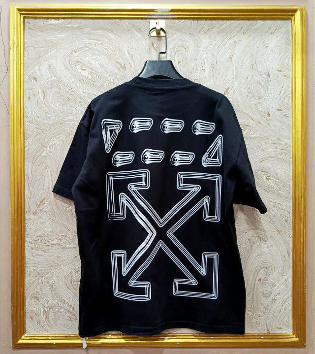 Black t-shirt with "Off-White™" design on a hanger against a decorative wall.