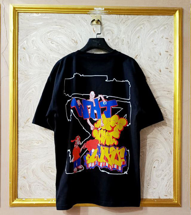 Black t-shirt with "Off-White™" design on a hanger against a decorative wall.