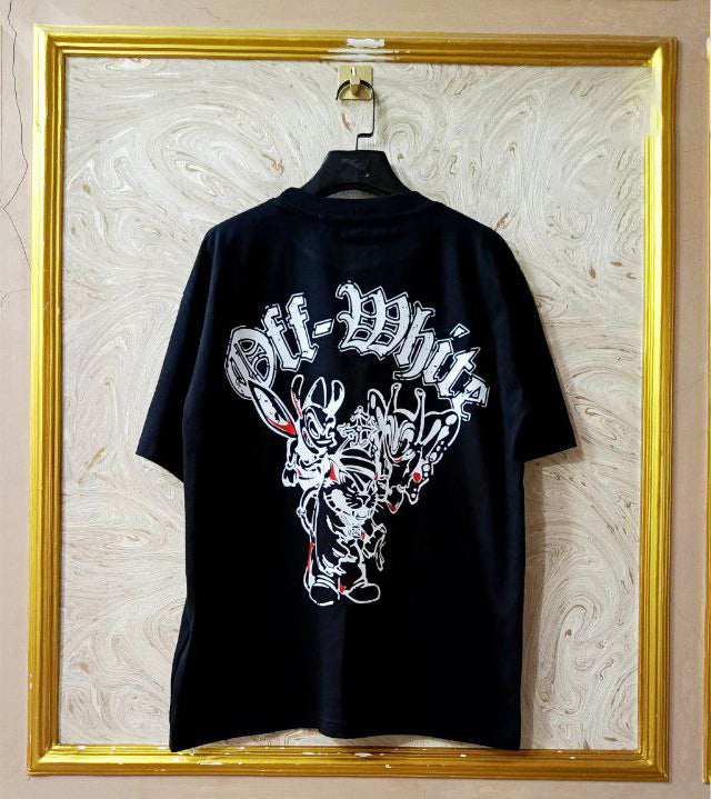 Black t-shirt with "Off-White™" design on a hanger against a decorative wall.