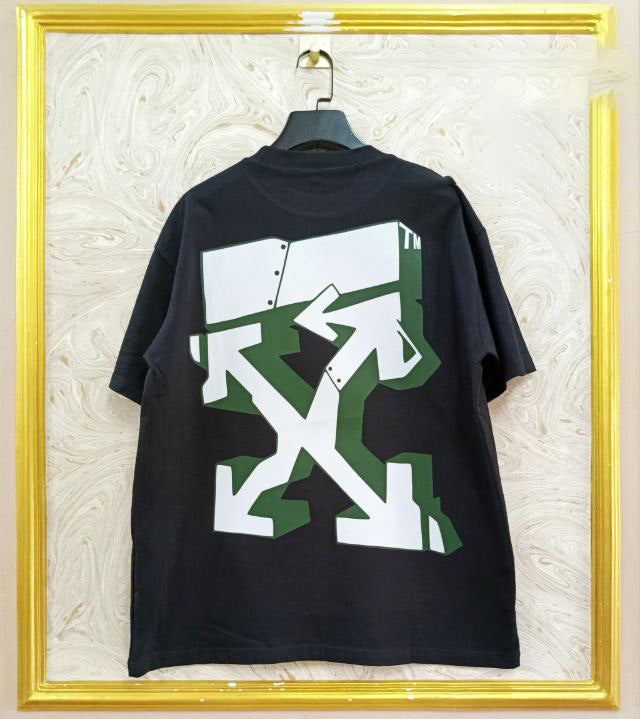 Black t-shirt with "Off-White™" design on a hanger against a decorative wall.