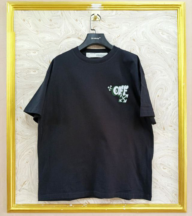 Black t-shirt with "Off-White™" logo on a hanger against a marble wall.