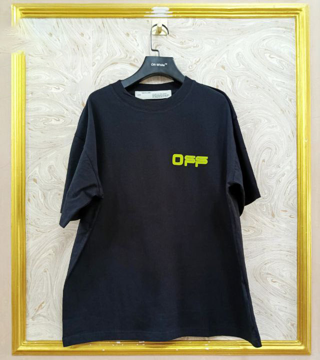 Black t-shirt with "Off-White™" logo on a hanger against a marble wall.