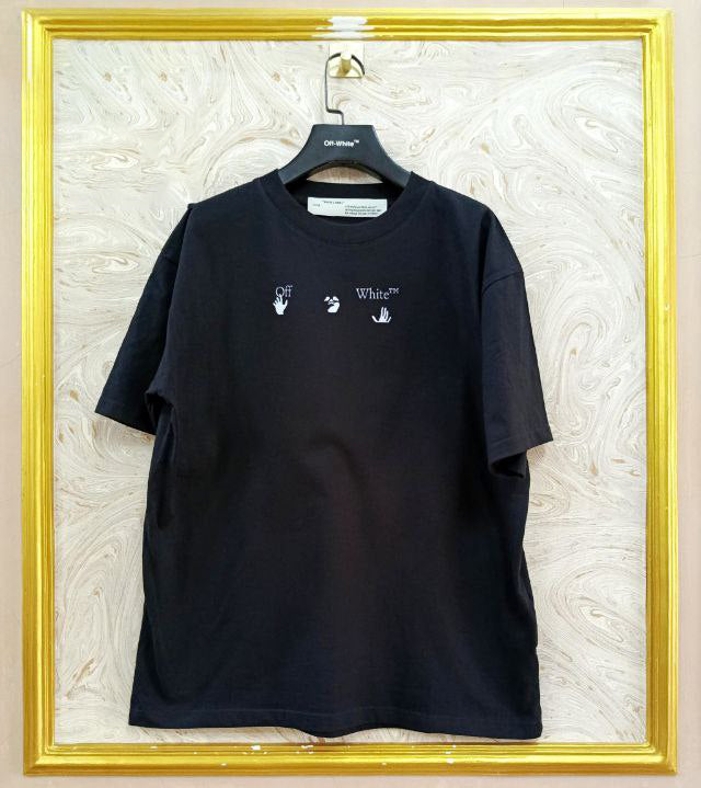 Black t-shirt with "Off-White™" logo on a hanger against a marble wall.