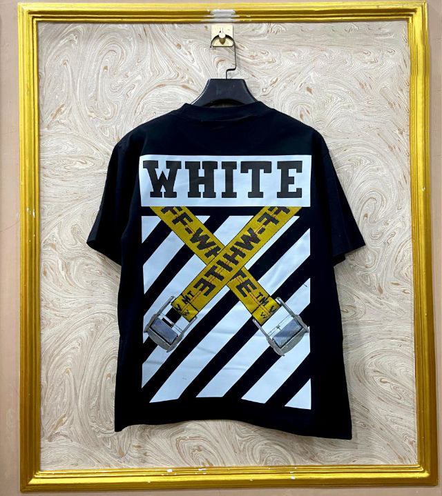 Black t-shirt with "Off-White™" design on a hanger against a decorative wall.