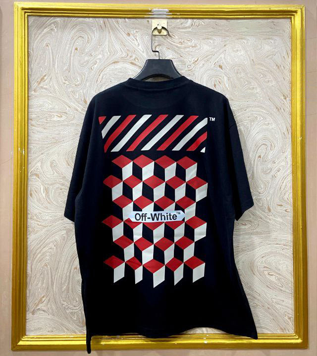Black t-shirt with "Off-White™" design on a hanger against a decorative wall.