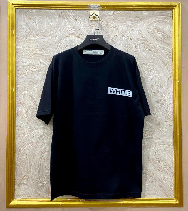 Black t-shirt with "Off-White™" logo on a hanger against a marble wall.