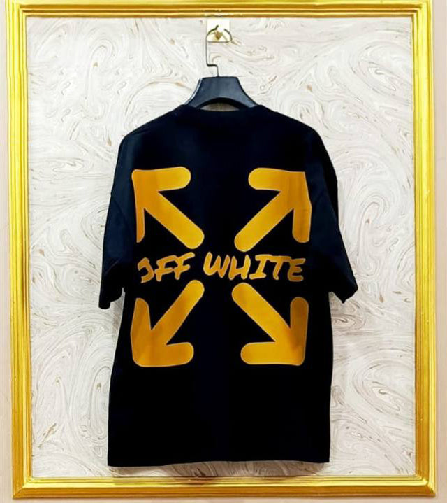 Black t-shirt with "Off-White™" design on a hanger against a decorative wall.