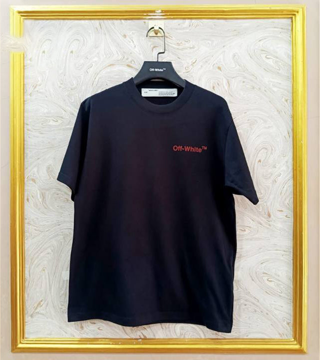 Black t-shirt with "Off-White™" logo on a hanger against a marble wall.