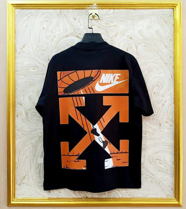 Black t-shirt with "Off-White™" design on a hanger against a decorative wall.