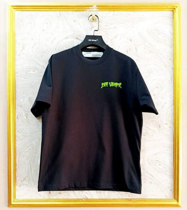 Black t-shirt with "Off-White™" logo on a hanger against a marble wall.