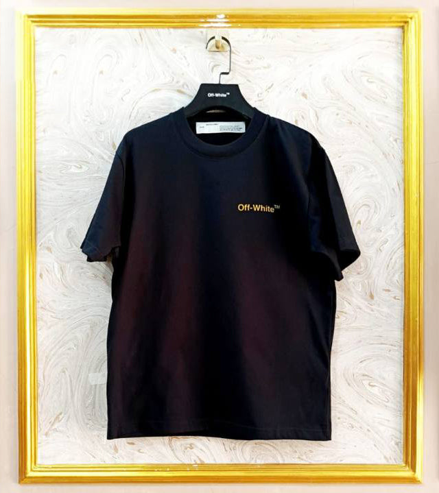 Black t-shirt with "Off-White™" logo on a hanger against a marble wall.