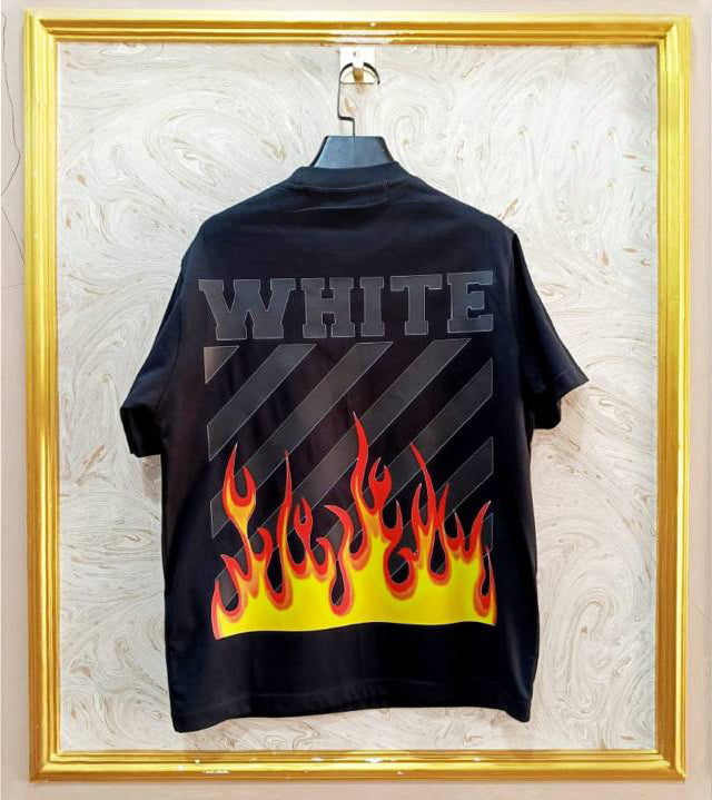 Black t-shirt with "Off-White™" design on a hanger against a decorative wall.