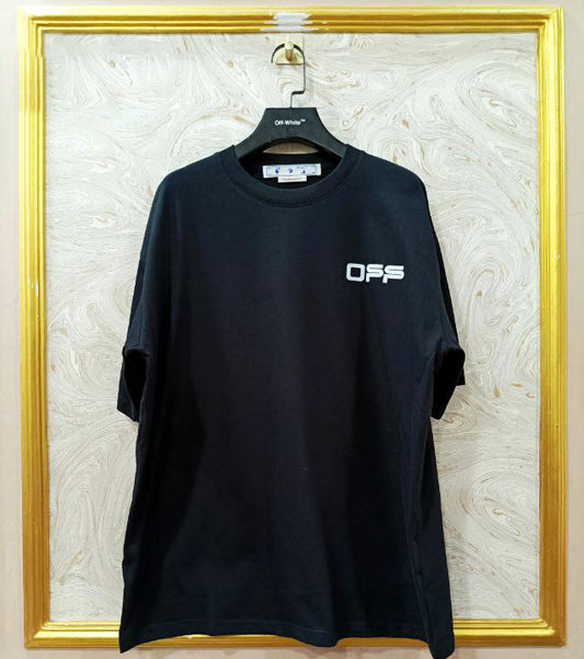 Black t-shirt with "Off-White™" logo on a hanger against a marble wall.
