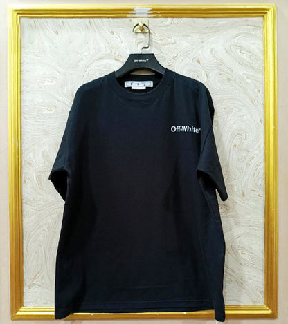 Black t-shirt with "Off-White™" logo on a hanger against a marble wall.