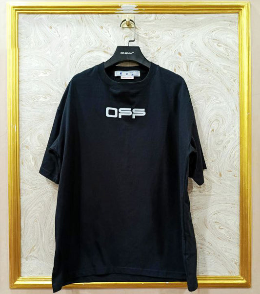 Black t-shirt with "Off-White™" logo on a hanger against a marble wall.