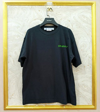 Black t-shirt with "Off-White™" logo on a hanger against a marble wall.