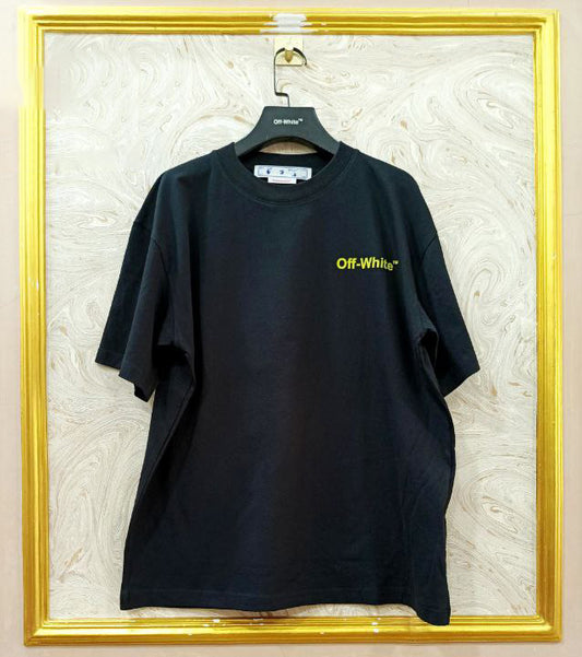 Black t-shirt with "Off-White™" logo on a hanger against a marble wall.