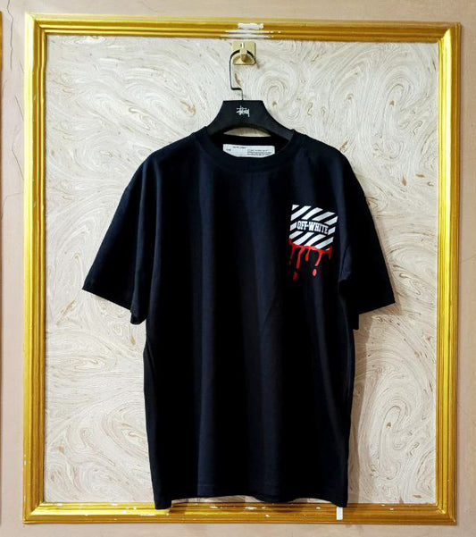 Black t-shirt with "Off-White™" logo on a hanger against a marble wall.
