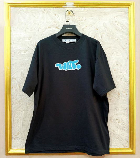 Black t-shirt with "Off-White™" logo on a hanger against a marble wall.