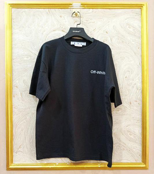 Black t-shirt with "Off-White™" logo on a hanger against a marble wall.