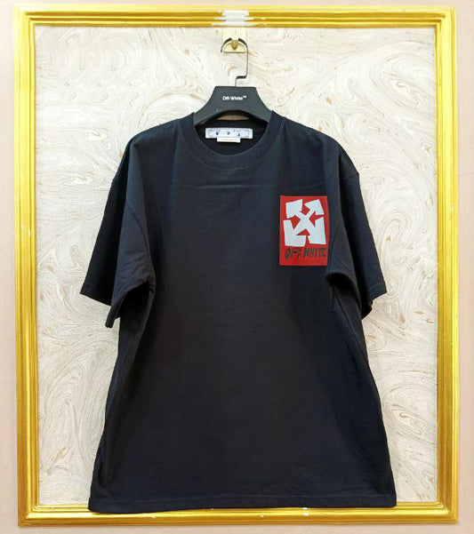 Black t-shirt with "Off-White™" logo on a hanger against a marble wall.