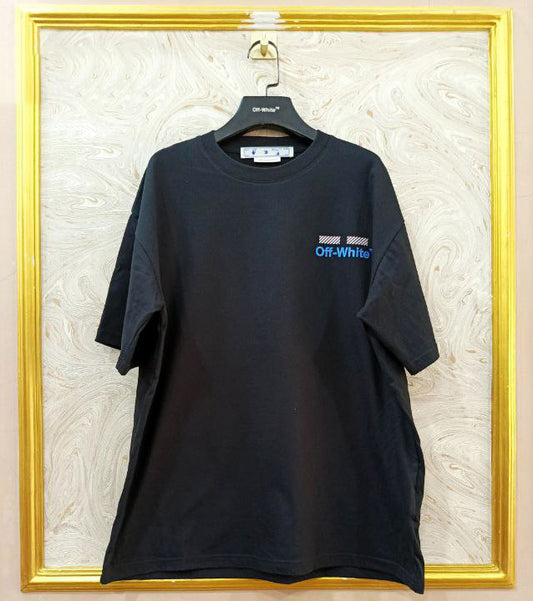 Black t-shirt with "Off-White™" logo on a hanger against a marble wall.