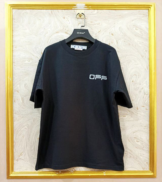 Black t-shirt with "Off-White™" logo on a hanger against a marble wall.