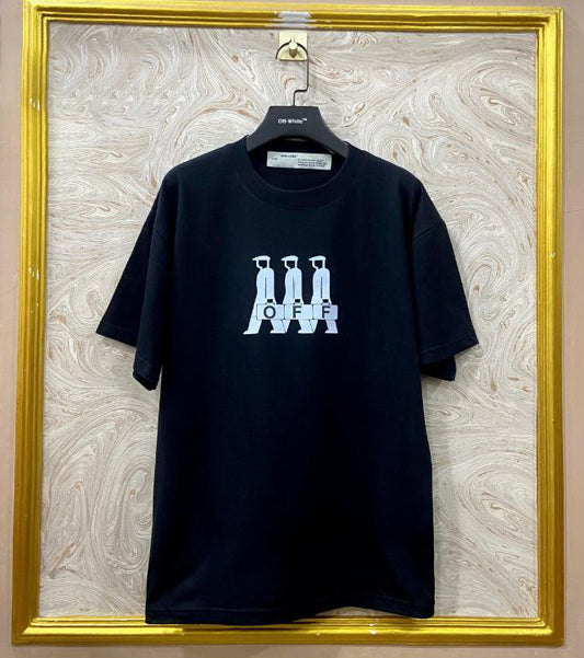 Black t-shirt with "Off-White™" logo on a hanger against a marble wall.