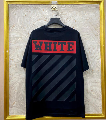 Black t-shirt with "Off-White™" design on a hanger against a decorative wall.