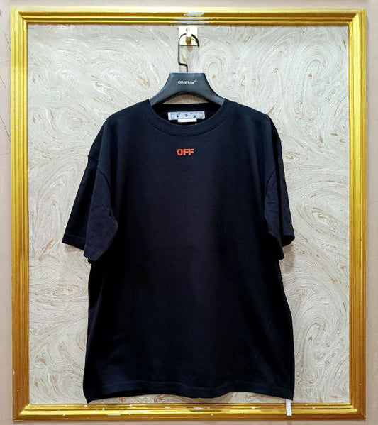 Black t-shirt with "Off-White™" logo on a hanger against a marble wall.