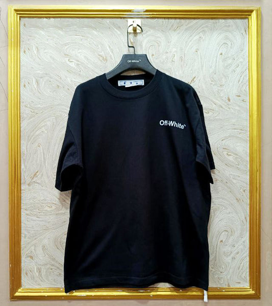 Black t-shirt with "Off-White™" logo on a hanger against a marble wall.