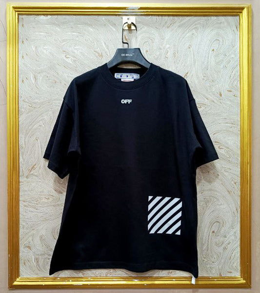 Black t-shirt with "Off-White™" logo on a hanger against a marble wall.