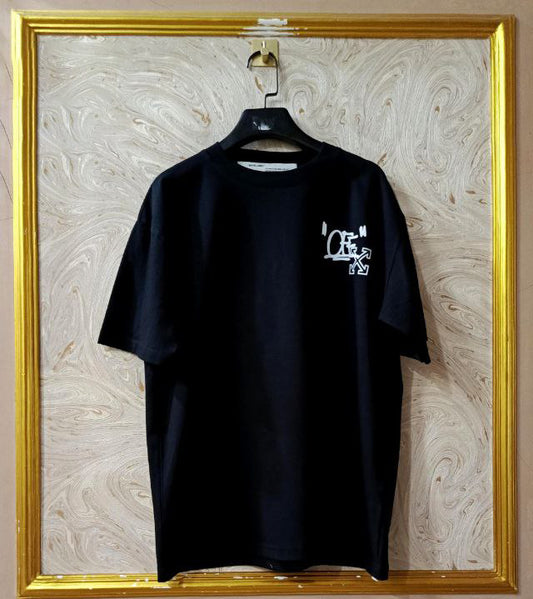 Black t-shirt with "Off-White™" logo on a hanger against a marble wall.