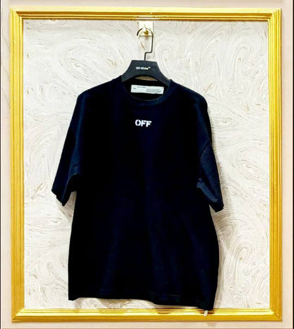 Black oversized t-shirt inspired by Off-White with “OFF” front logo, displayed on hanger in gold frame.