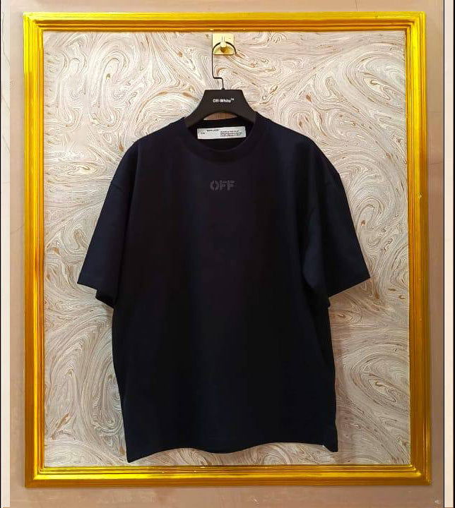 Black oversized t-shirt inspired by Off-White with “OFF” front logo, displayed on hanger in gold frame.