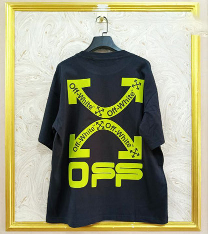 Black t-shirt with "Off-White™" design on a hanger against a decorative wall.
