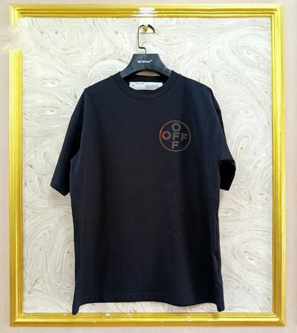 Black t-shirt with "Off-White™" logo on a hanger against a marble wall.