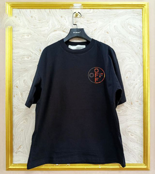 Black t-shirt with "Off-White™" logo on a hanger against a marble wall.